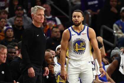 Phoenix, Arizona, USA; Golden State Warriors guard Stephen Curry (30) reacts alongside head coach Steve Kerr against the Phoenix Suns in the second half at Mortgage Matchup Center. Mandatory Credit: Mark J. Rebilas-Imagn Images