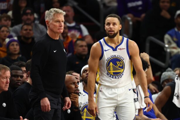 Phoenix, Arizona, USA; Golden State Warriors guard Stephen Curry (30) reacts alongside head coach Steve Kerr against the Phoenix Suns in the second half at Mortgage Matchup Center. Mandatory Credit: Mark J. Rebilas-Imagn Images