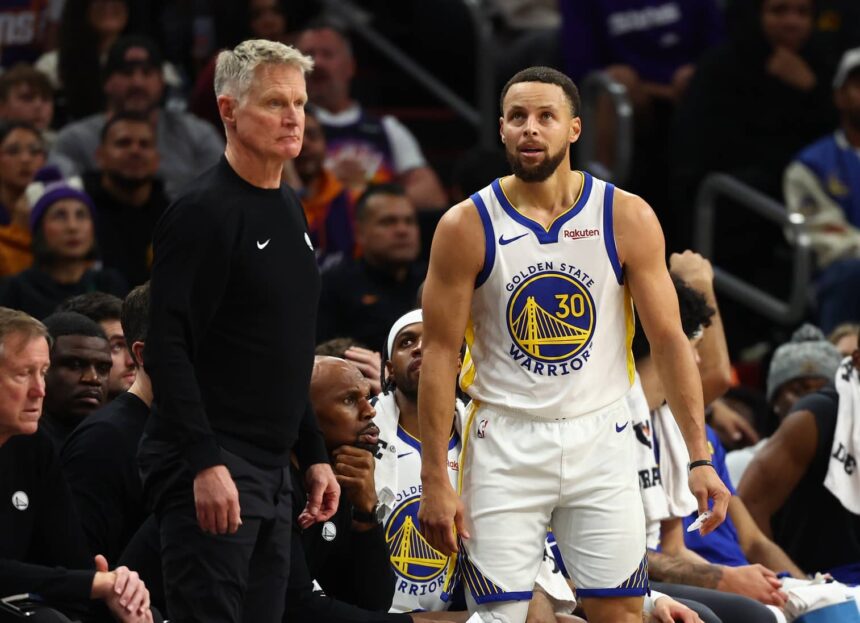 Phoenix, Arizona, USA; Golden State Warriors guard Stephen Curry (30) reacts alongside head coach Steve Kerr against the Phoenix Suns in the second half at Mortgage Matchup Center. Mandatory Credit: Mark J. Rebilas-Imagn Images