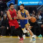 San Francisco, California, USA; Golden State Warriors guard Stephen Curry (30) dribbles by Portland Trail Blazers forward Toumani Camara (33) in the third quarter at Chase Center. Mandatory Credit: David Gonzales-Imagn Images