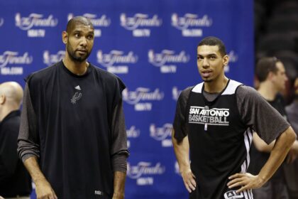 San Antonio, TX, USA; San Antonio Spurs power forward Tim Duncan (left) and shooting guard Danny Green (right) talk during practice before game 4 of the 2013 NBA Finals against the Miami Heat at AT&T Center. Mandatory Credit: Soobum Im-Imagn Images