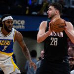 Feb 2, 2026; Indianapolis, Indiana, USA; Houston Rockets center Alperen Sengun (28) holds the ball while Indiana Pacers forward Isaiah Jackson (22) defends in the second half at Gainbridge Fieldhouse. Mandatory Credit: Trevor Ruszkowski-Imagn Images