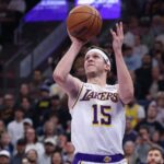 Nov 23, 2025; Salt Lake City, Utah, USA; Los Angeles Lakers guard Austin Reaves (15) takes a shot at the buzzer against the Utah Jazz to end the first half at Delta Center. Mandatory Credit: Rob Gray-Imagn Images