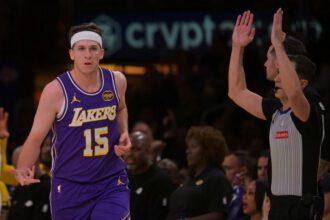 Feb 5, 2026; Los Angeles, California, USA; Los Angeles Lakers guard Austin Reaves (15) heads down court after a three-point basket in the first half against the Philadelphia 76ers at Crypto.com Arena. Mandatory Credit: Jayne Kamin-Oncea-Imagn Images