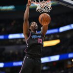 Feb 8, 2026; Washington, District of Columbia, USA; Miami Heat center Bam Adebayo (13) inks the ball against the Washington Wizards during the second quarter at Capital One Arena. Mandatory Credit: Rafael Suanes-Imagn Images