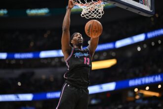 Feb 8, 2026; Washington, District of Columbia, USA; Miami Heat center Bam Adebayo (13) inks the ball against the Washington Wizards during the second quarter at Capital One Arena. Mandatory Credit: Rafael Suanes-Imagn Images