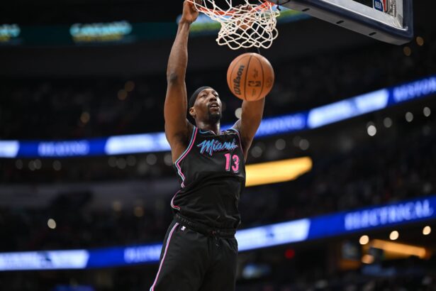 Feb 8, 2026; Washington, District of Columbia, USA; Miami Heat center Bam Adebayo (13) inks the ball against the Washington Wizards during the second quarter at Capital One Arena. Mandatory Credit: Rafael Suanes-Imagn Images