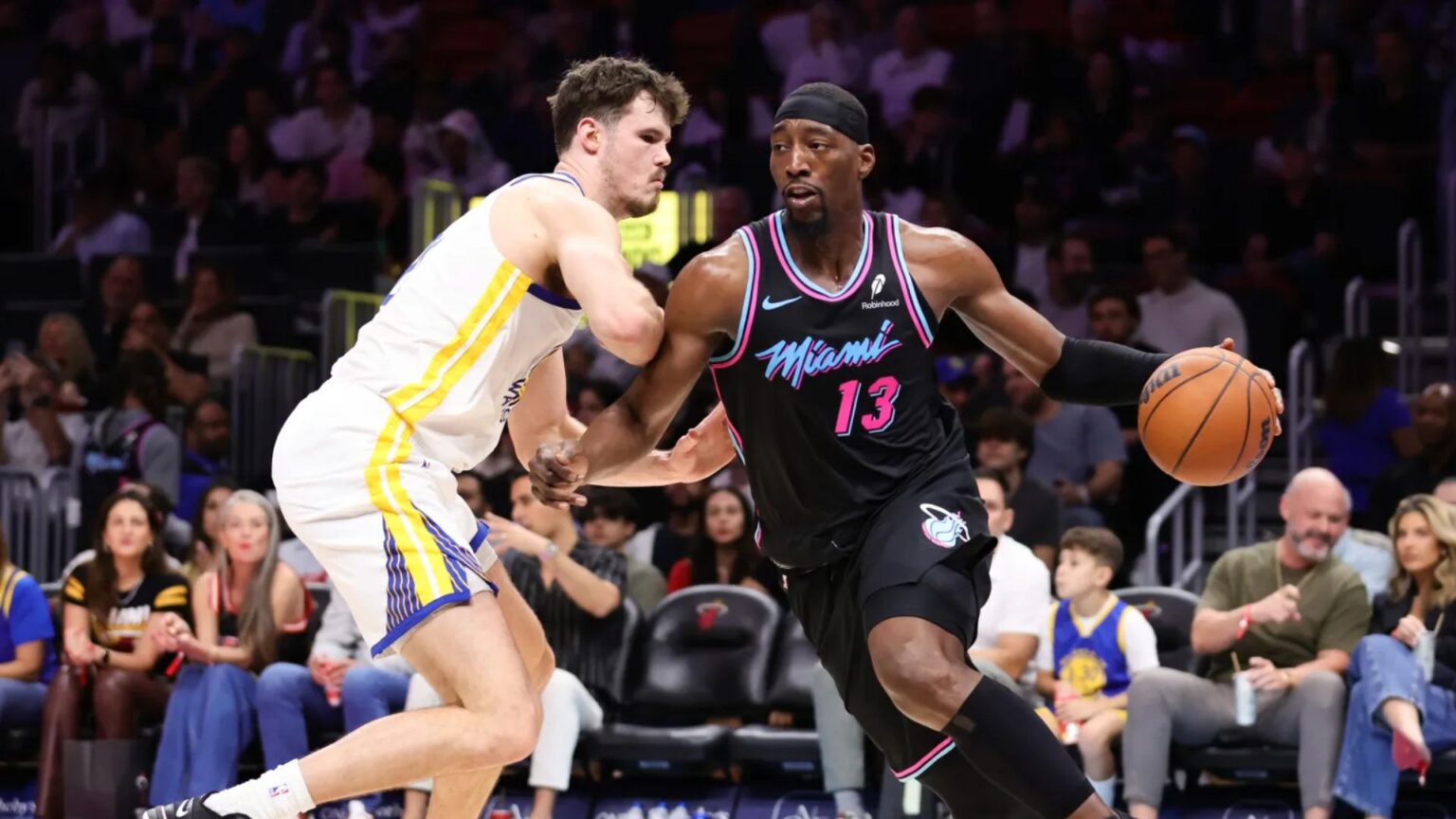 Bam Adebayo drives past Quinten Post during a game against the Golden State Warriors. Mandatory Credit: Megan Briggs - Getty Images
