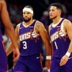 Oct 22, 2025; Phoenix, Arizona, USA; Phoenix Suns guard Devin Booker (1) and forward Dillon Brooks (3) during the second half against the Sacramento Kings at the Mortgage Matchup Center. Mandatory Credit: Mark J. Rebilas-Imagn Images