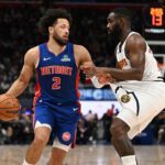 Feb 3, 2026; Detroit, Michigan, USA; Detroit Pistons guard Cade Cunningham (2) tugs on the shorts of Denver Nuggets guard Tim Hardaway Jr. (10) before trying to drive past him in the second quarter at Little Caesars Arena. Mandatory Credit: Lon Horwedel-Imagn Images