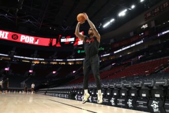 Feb 9, 2026; Portland, Oregon, USA; Portland Trail Blazers guard Damian Lillard (0) shoots a three-point shot during warm ups before the Trail Blazers play against the Philadelphia 76ers at Moda Center. Mandatory Credit: Jaime Valdez-Imagn Images