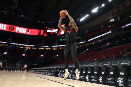 Feb 9, 2026; Portland, Oregon, USA; Portland Trail Blazers guard Damian Lillard (0) shoots a three-point shot during warm ups before the Trail Blazers play against the Philadelphia 76ers at Moda Center. Mandatory Credit: Jaime Valdez-Imagn Images