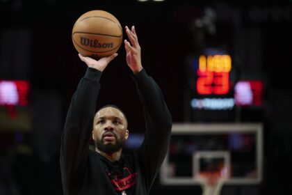 Dec 29, 2025; Portland, Oregon, USA; Portland Trail Blazers guard Damian Lillard (0) warms up before a game against the Dallas Mavericks at Moda Center. Mandatory Credit: Troy Wayrynen-Imagn Images