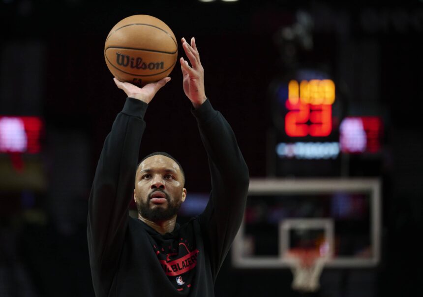 Dec 29, 2025; Portland, Oregon, USA; Portland Trail Blazers guard Damian Lillard (0) warms up before a game against the Dallas Mavericks at Moda Center. Mandatory Credit: Troy Wayrynen-Imagn Images
