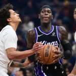 Sacramento Kings guard Dennis Schroder (17) drives to the basket against Cleveland Cavaliers guard Craig Porter Jr. (9) during the first half at Rocket Arena.