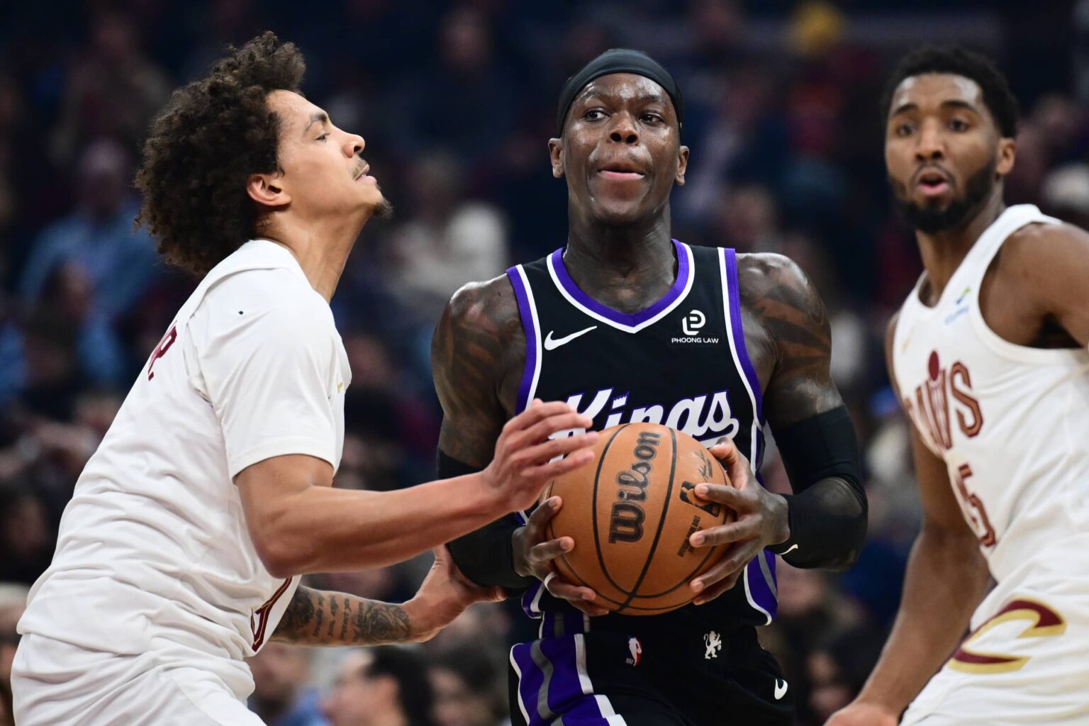 Sacramento Kings guard Dennis Schroder (17) drives to the basket against Cleveland Cavaliers guard Craig Porter Jr. (9) during the first half at Rocket Arena.