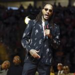 Derrick Rose speaks during his jersey retirement ceremony after an NBA game between the Chicago Bulls and Boston Celtics at United Center.