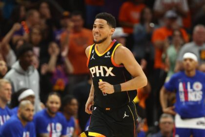 Phoenix Suns guards Devin Booker (1) smiles after a shot against the Los Angeles Clippers during the first half in game five of the 2023 NBA playoffs at Footprint Center.