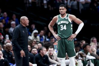 Mar 1, 2025; Dallas, Texas, USA; Milwaukee Bucks head coach Doc Rivers speaks to Milwaukee Bucks forward Giannis Antetokounmpo (34) during the second half against the Dallas Mavericks at American Airlines Center. Mandatory Credit: Kevin Jairaj-Imagn Images