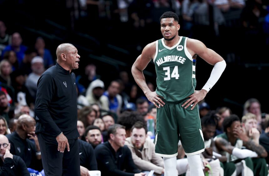 Mar 1, 2025; Dallas, Texas, USA; Milwaukee Bucks head coach Doc Rivers speaks to Milwaukee Bucks forward Giannis Antetokounmpo (34) during the second half against the Dallas Mavericks at American Airlines Center. Mandatory Credit: Kevin Jairaj-Imagn Images
