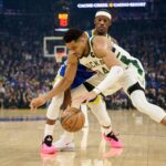 Jan 7, 2026; San Francisco, California, USA; Milwaukee Bucks forward Giannis Antetokounmpo (34) dribbles the ball against Golden State Warriors forward Jimmy Butler III (10) during the first quarter at Chase Center. Mandatory Credit: Robert Edwards-Imagn Images