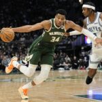 Feb 8, 2024; Milwaukee, Wisconsin, USA; Milwaukee Bucks forward Giannis Antetokounmpo (34) drives for the basket against Minnesota Timberwolves forward Jaden McDaniels (3) during the third quarter at Fiserv Forum. Mandatory Credit: Jeff Hanisch-USA TODAY Sports