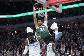 Apr 8, 2025; Milwaukee, Wisconsin, USA; Milwaukee Bucks forward Giannis Antetokounmpo (34) dunks the ball against Minnesota Timberwolves guard Mike Conley (10) in the second half at Fiserv Forum. Mandatory Credit: Michael McLoone-Imagn Images