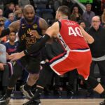 Jan 22, 2026; Inglewood, California, USA; Los Angeles Lakers forward LeBron James (23) is defended by Los Angeles Clippers center Ivica Zubac (40) in the second half at Intuit Dome. Mandatory Credit: Jayne Kamin-Oncea-Imagn Images