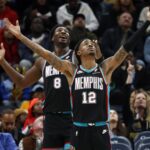 Nov 9, 2025; Memphis, Tennessee, USA; Memphis Grizzlies forward/center Jaren Jackson Jr. (8) and guard Ja Morant (12) react during the third quarter against the Oklahoma City Thunder at FedExForum. Mandatory Credit: Petre Thomas-Imagn Images