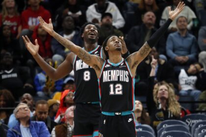 Nov 9, 2025; Memphis, Tennessee, USA; Memphis Grizzlies forward/center Jaren Jackson Jr. (8) and guard Ja Morant (12) react during the third quarter against the Oklahoma City Thunder at FedExForum. Mandatory Credit: Petre Thomas-Imagn Images