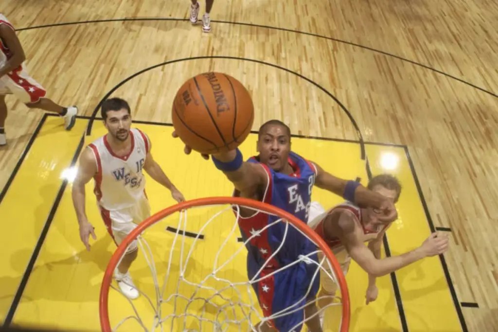 LOS ANGELES - FEBRUARY 15: Jamaal Magloire #21 of the Eastern Conference shoots a layup against Dirk Nowitzki #41 of the Western Conference during the 2004 All-Star Game on February 15, 2004 at Staples Center in Los Angeles, California. (Photo by Nathaniel S. ButlerNBAE via Getty Images)
