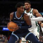 Oct 31, 2024; Memphis, Tennessee, USA; Memphis Grizzlies forward Jaren Jackson Jr. (13) drives to the basket as Milwaukee Bucks forward Giannis Antetokounmpo (34) defends during the second half at FedExForum. Mandatory Credit: Petre Thomas-Imagn Images