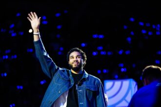Oct 3, 2025; Durham, NC, USA; Jayson Tatum, NBA Boston Celtics Player helps coach alongside Duke Blue Devils head coach Jon Scheyer during the Countdown to Craziness at the Cameron Indoor Stadium. Mandatory Credit: Jaylynn Nash-Imagn Images