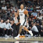 Nov 16, 2025; San Antonio, Texas, USA; San Antonio Spurs forward Jeremy Sochan (10) dribbles up the court in the first half against the Sacramento Kings at Frost Bank Center. Mandatory Credit: Daniel Dunn-Imagn Images