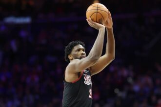 Jan 31, 2026; Philadelphia, Pennsylvania, USA; Philadelphia 76ers center Joel Embiid (21) shoots the ball against the New Orleans Pelicans during the fourth quarter at Xfinity Mobile Arena. Mandatory Credit: Bill Streicher-Imagn Images