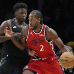 Feb 8, 2026; Minneapolis, Minnesota, USA; Los Angeles Clippers forward Kawhi Leonard (2) works around Minnesota Timberwolves guard Anthony Edwards (5) in the first quarter at Target Center. Mandatory Credit: Bruce Kluckhohn-Imagn Images