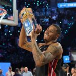 Feb 14, 2026; Los Angeles, CA, USA; Miami Heat forward Keshad Johnson (16) celebrates with the trophy after winning the slam dunk competition during the 2026 NBA All Star Saturday Night at Intuit Dome. Mandatory Credit: Jayne Kamin-Oncea-Imagn Images