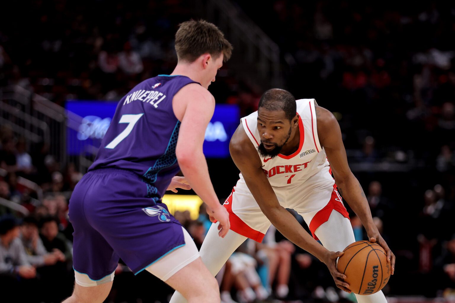 Feb 5, 2026; Houston, Texas, USA; Houston Rockets forward Kevin Durant (7) handles the ball against Charlotte Hornets guard Kon Knueppel (7) during the third quarter at Toyota Center. Mandatory Credit: Erik Williams-Imagn Images