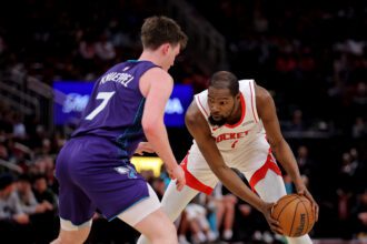 Feb 5, 2026; Houston, Texas, USA; Houston Rockets forward Kevin Durant (7) handles the ball against Charlotte Hornets guard Kon Knueppel (7) during the third quarter at Toyota Center. Mandatory Credit: Erik Williams-Imagn Images