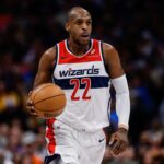 Jan 17, 2026; Denver, Colorado, USA; Washington Wizards forward Khris Middleton (22) dribbles the ball up court in the fourth quarter against the Denver Nuggets at Ball Arena. Mandatory Credit: Isaiah J. Downing-Imagn Images