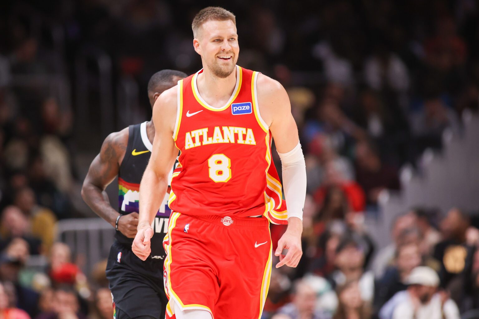Dec 5, 2025; Atlanta, Georgia, USA; Atlanta Hawks center Kristaps Porzingis (8) reacts after a basket against the Denver Nuggets in the third quarter at State Farm Arena. Mandatory Credit: Brett Davis-Imagn Images
