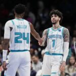 Feb 2, 2026; Charlotte, North Carolina, USA;Charlotte Hornets guard LaMelo Ball (1) and forward Brandon Miller (24) high five during the second quarter against the New Orleans Pelicans at the Spectrum Center. Mandatory Credit: Jim Dedmon-Imagn Images