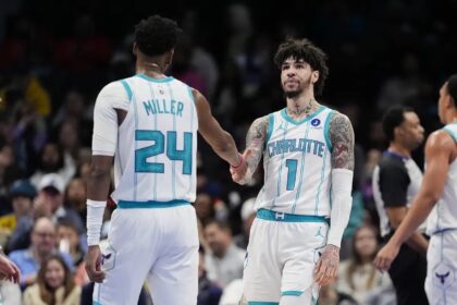 Feb 2, 2026; Charlotte, North Carolina, USA;Charlotte Hornets guard LaMelo Ball (1) and forward Brandon Miller (24) high five during the second quarter against the New Orleans Pelicans at the Spectrum Center. Mandatory Credit: Jim Dedmon-Imagn Images
