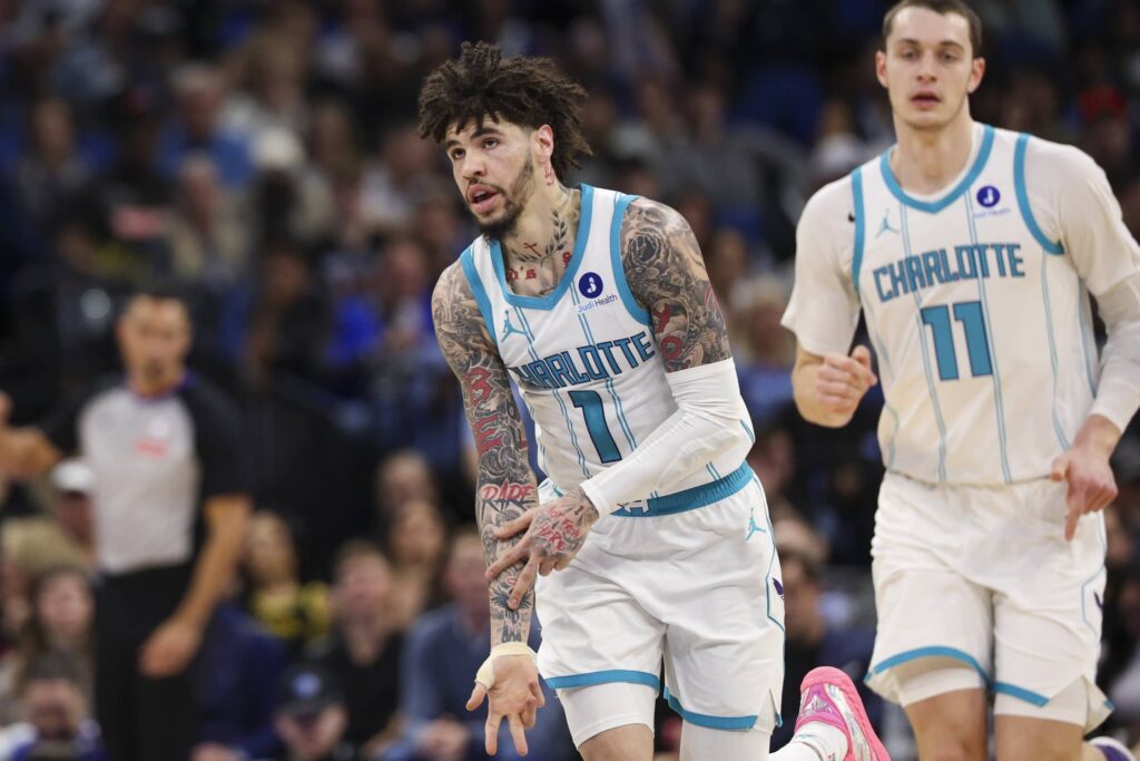 Jan 22, 2026; Orlando, Florida, USA; Charlotte Hornets guard LaMelo Ball (1) reacts after making a basket against the Orlando Magic in the second quarter at Kia Center. Mandatory Credit: Nathan Ray Seebeck-Imagn Images