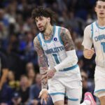 Jan 22, 2026; Orlando, Florida, USA; Charlotte Hornets guard LaMelo Ball (1) reacts after making a basket against the Orlando Magic in the second quarter at Kia Center. Mandatory Credit: Nathan Ray Seebeck-Imagn Images