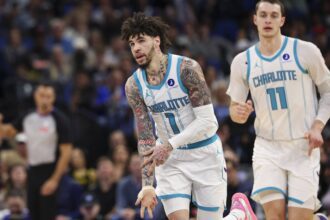 Jan 22, 2026; Orlando, Florida, USA; Charlotte Hornets guard LaMelo Ball (1) reacts after making a basket against the Orlando Magic in the second quarter at Kia Center. Mandatory Credit: Nathan Ray Seebeck-Imagn Images
