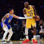 Feb 7, 2026; Los Angeles, California, USA; Los Angeles Lakers forward LeBron James (23) controls the ball against Golden State Warriors guard Will Richard (3) during the second half at Crypto.com Arena. Mandatory Credit: Gary A. Vasquez-Imagn Images