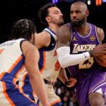 Feb 1, 2026; New York, New York, USA; Los Angeles Lakers forward LeBron James (23) drives to the basket against New York Knicks guards Jalen Brunson (11) and Landry Shamet (44) during the third quarter at Madison Square Garden. Mandatory Credit: Brad Penner-Imagn Images