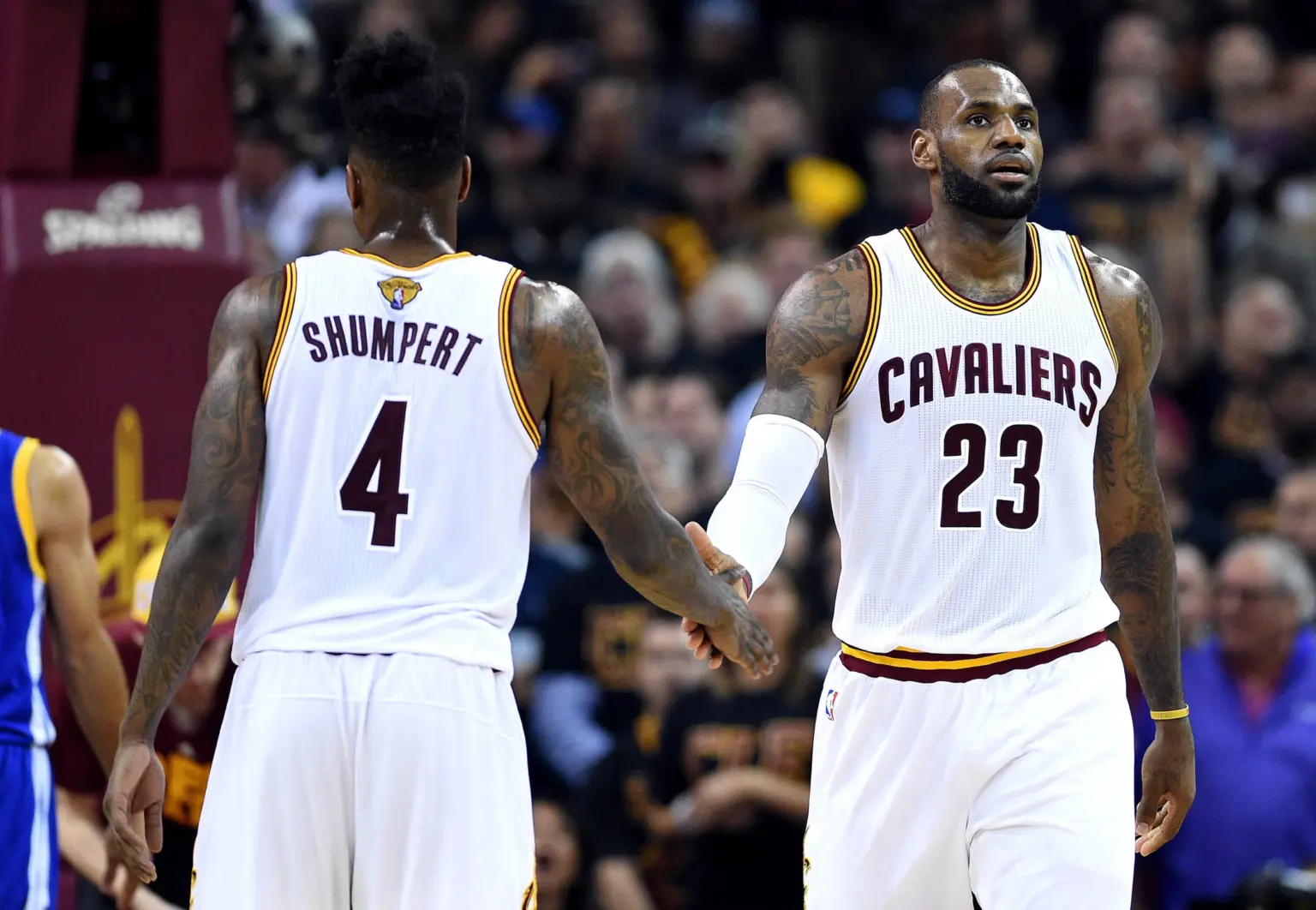 Jun 16, 2016; Cleveland, OH, USA; Cleveland Cavaliers forward LeBron James (23) celebrates with Cleveland Cavaliers guard Iman Shumpert (4) during the second quarter in game six of the NBA Finals at Quicken Loans Arena. Mandatory Credit: Bob Donnan-Imagn Images
