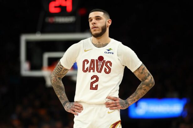 Jan 30, 2026; Phoenix, Arizona, USA; Cleveland Cavaliers guard Lonzo Ball (2) against the Phoenix Suns at Mortgage Matchup Center. Mandatory Credit: Mark J. Rebilas-Imagn Images